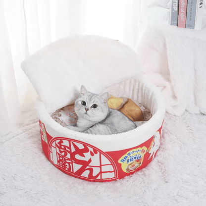 chat couche dans chat panier rouge rond design nouille